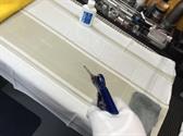 Using compressed air to blow off any dust or particles
